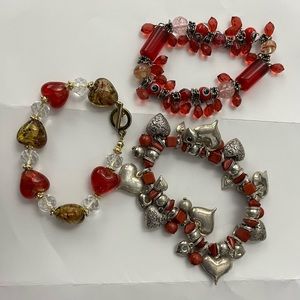 3 red beaded bracelets strung on elastic.Should fit wrists up to 8” comfortably.